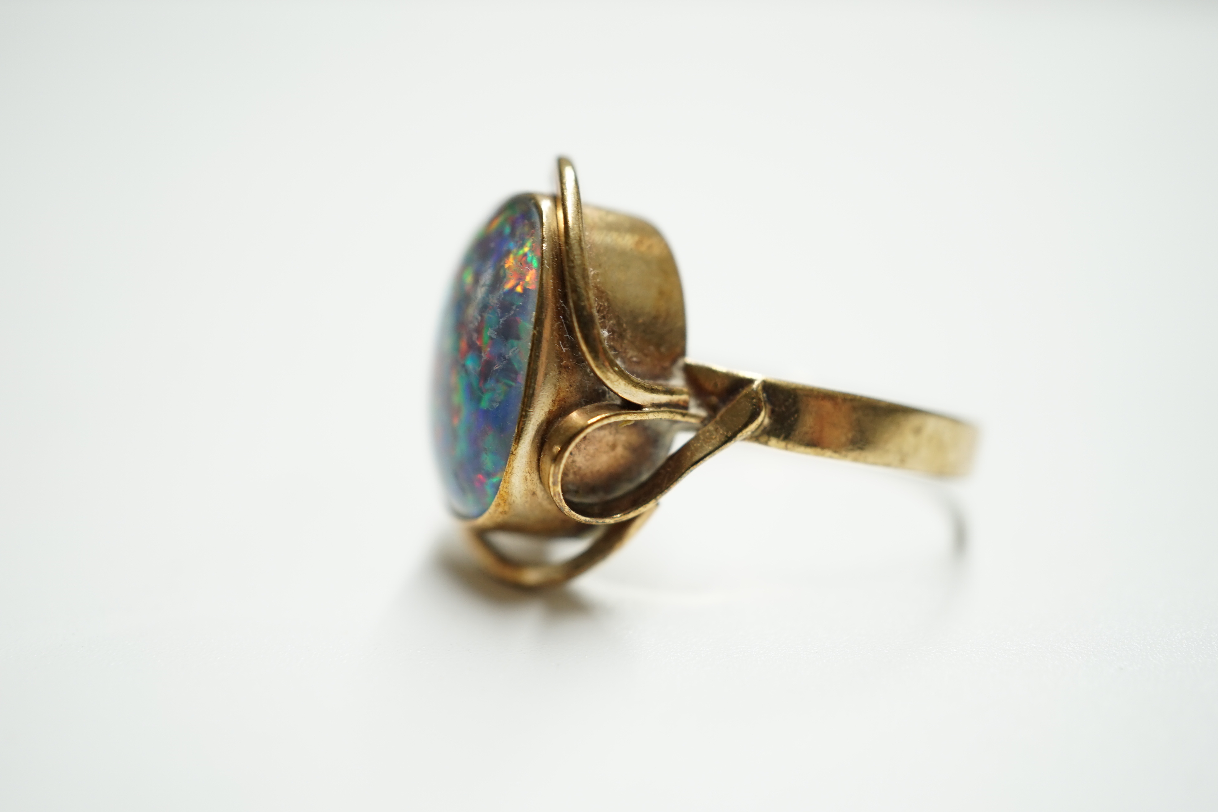 A 9ct? and oval black opal doublet set ring, size Q, gross weight 4.6 grams. Condition - poor